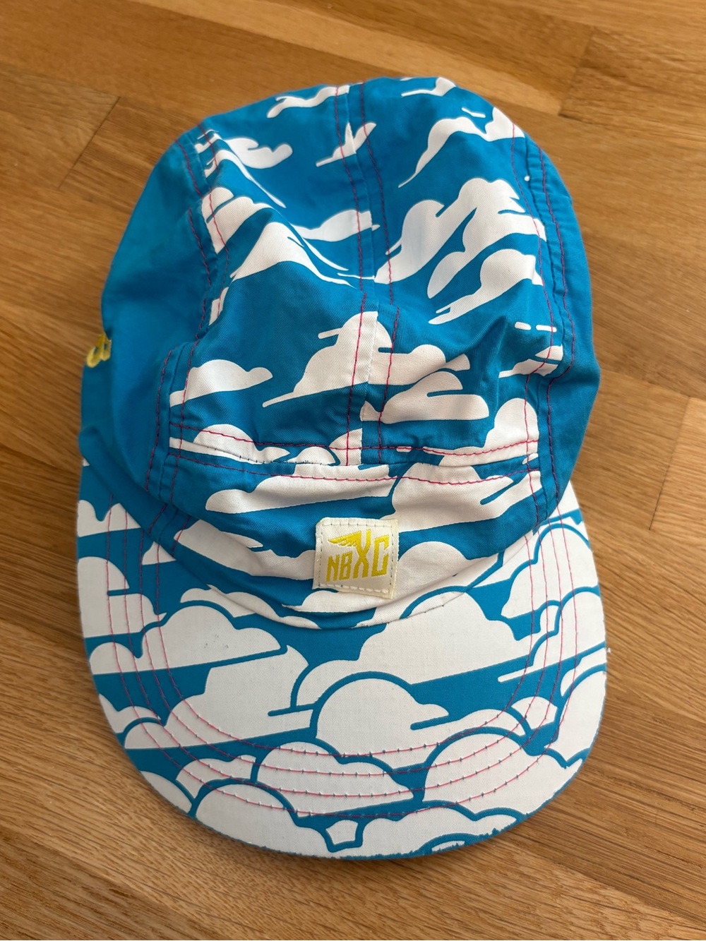 New Balance NBXC 5 Panel Running Hat Blue White Cross Country Clouds